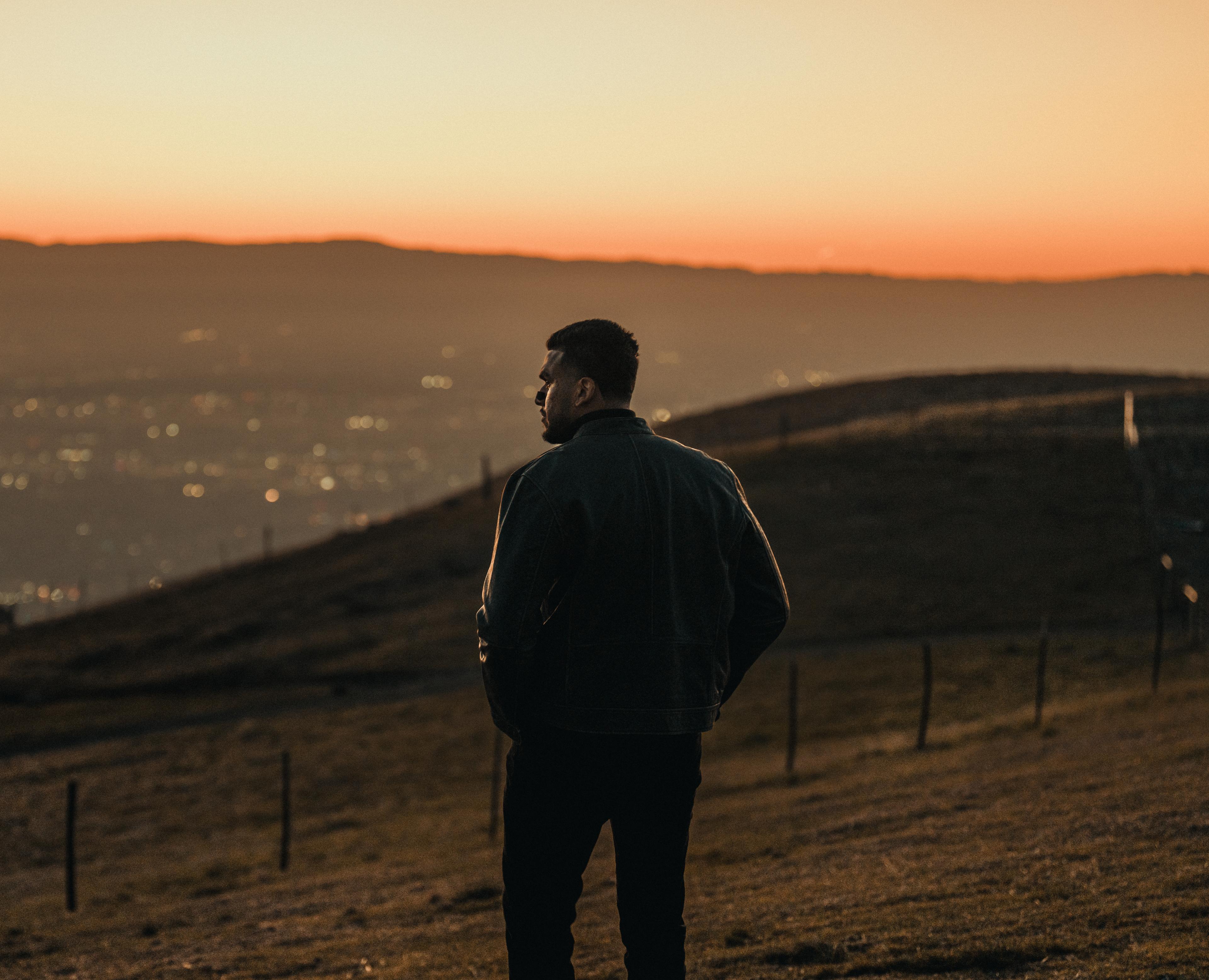Hero background image of a man looking over a city
